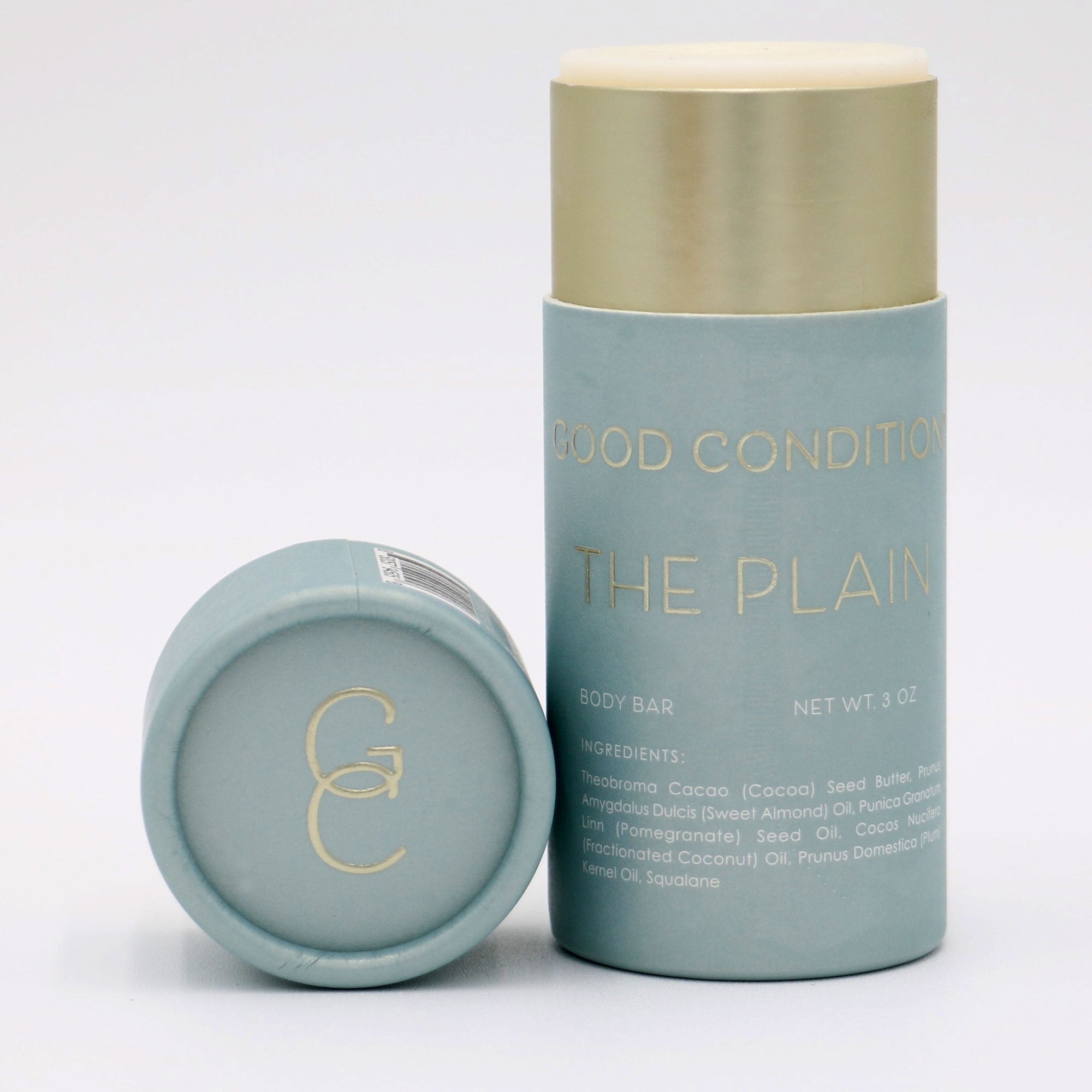 Good Condition The Plain organic cocoa butter body moisturizer tube. Made with sweet almond oil, pomegranate seed oil, plum kernel oil and squalane.